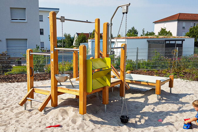 Playgrounds for housing estates – eibe sand play equipment in a residential area.